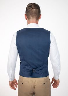 Experience classic styling and modern finesse wearing the Prussian Blue Pinstripe vest. Featuring a vibrant blue hue with subtle pinstripes, this custom made vest will make you feel vibrant and confident. Fitted Navy Sleeveless Vest, Fitted Blue Vest For Workwear, Blue Fitted Vest For Work, Fitted Pinstripe Vest For Work, Sleeveless Tailored Blue Suit, Tailored Pinstripe Business Vest, Tailored Pinstripe Vest For Business, Tailored Pinstripe Sleeveless Vest, Pinstripe Tailored Sleeveless Vest