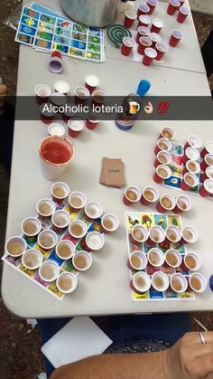 the table is covered with cups and paints