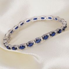 Blue Sapphire Bracelet, Diamond Bracelet, Tennis Bracelet, Gemstone Bracelet, Wedding Engagement Bracelet, Gift For Her, Party Wear Bracelet. Blue Sapphire bracelet diamond looks western and stylish modular design bracelet is make in 925 sterling silver base metal . all types of customization are available we can customize these as per the requirements also . These blue sapphire and white diamond is a suitable for all types of skin tones . also you can wear these as per your any outfits . specia Blue Cubic Zirconia Wedding Bracelet, Blue Tennis Bracelet For Wedding, Wedding Sapphire Diamond Bracelet With 17 Jewels, Formal Sapphire Bracelet, Sapphire Bangle Bracelet For Formal Occasions, Adjustable Sapphire Bracelets For Wedding, Blue Diamond Wedding Bracelet, Blue Jubilee Bracelet Jewelry For Wedding, Blue Diamond Bracelet For Wedding