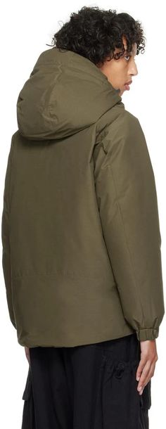 Snow Peak.Khaki 2 Layer Down Jacket.Down-filled 2L recycled polyester- and aramid-blend ripstop jacket. Fire-resistant, wind-resistant, and waterproof..· Bungee-style drawstring at detachable hood.· Throat guard at hood.· Funnel neck.· Two-way zip closure with press-stud placket.· Zip pocket and welt pockets.· Logo bonded at front hem.· Bungee-style drawstring at hem.· Raglan sleeves.· Elasticized cuffs.· Mesh patch pocket at interior.· Full quilted taffeta lining.Supplier color: Olive.Fill: 90% Hooded Fall Outerwear In Recycled Polyester, Hooded Recycled Polyester Fall Outerwear, Recycled Polyester Hooded Fall Outerwear, Solid Parka With Fleece Lining For Hiking, Hiking Parka With Fleece Lining, Cold Weather Outerwear With Detachable Hood In Recycled Polyester, Recycled Polyester Outerwear With Detachable Hood For Cold Weather, Outdoor Outerwear With Detachable Hood And Recycled Polyester, Nylon Parka For Cold Weather