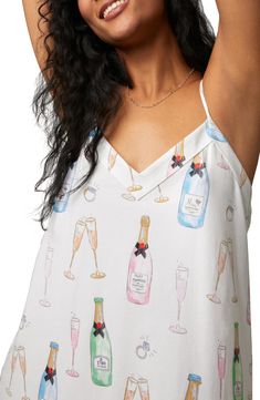 Start your new life together with plenty of sparkling toasts and time spent in this playful organic-cotton jersey chemise topped with dainty straps. 34" length V-neck Adjustable straps 93% organic cotton, 7% elastane Machine wash, tumble dry Imported Cotton Camisole With Spaghetti Straps For Party, Summer Nightgown With Delicate Straps For Loungewear, V-neck Top For Bedtime In Summer, Summer Sleep Tops With Delicate Straps, Sleeveless Top For Spring Wedding, Sleeveless Tops For Wedding Night In Spring, Summer Wedding Night Camisole Sleepwear, Feminine Summer Wedding Night Camisole, Summer Wedding Night Sleepwear With Spaghetti Straps