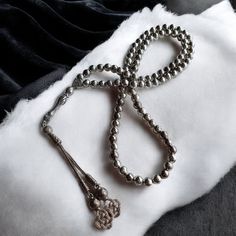 This unique rosary is handmade and all beads are stainless metal. The harmony between the gorgeous gold color and the carved lines of the beads is mesmerizing. It is also known by different names such as misbaha, prayer beads, tasbeeh, chapelet, dhikr beads, misbah, sibha, stress beads. This islamic tasbih is a great muslim gift idea. Tassel material is also stainless metal. PRODUCT DETAILS Weight: 140gr  Grain Length: 7.5mm (0.29") Grain Width: 7.5mm (0.29") Total Length: 51cm (20.07") All our Silver Round Beads For Jewelry Making, Traditional Silver Rosary As Gift, Traditional Handmade Rosary Bracelet With Round Beads, Traditional Adjustable Rosary With Polished Beads, Traditional Handmade Rosary Bracelet, Traditional Silver Rosary With Polished Beads, Traditional Round Beads Mala For Blessing, Spiritual Round Beads Rosary For Jewelry Making, Traditional Mala With Round Beads For Blessing