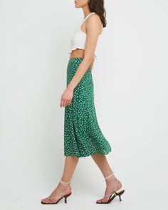 Price Comparison Few Moda $49 Alice + Olivia $440 Max Mara $125 Product Details Fun and fresh, this midi skirt is done in a sweet green print with a simple silhouette.- Back zipper- Lined- Content: 100% Polyester Style# K22WSK60008 Fit Notes - Model wearing a size S- Model measurements: Height: 5'10" Bust: 34" Waist: 24" Hips: 35" Spring Green Pleated Maxi Skirt, Spring Green Flowy Skirt, Spring Long Green Skirt, Green Lined Maxi Skirt For Spring, Green Long Skirt For Spring, Green Lined Skirt For Spring, Casual Green Floral Print Skirt, Green Floral Print Knee-length Skirt, Green Tiered Maxi Skirt For Spring