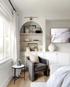 a living room filled with furniture and white walls