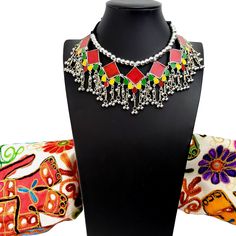 Summer is here! Celebrate with a colorful, playful, fun choker that compliments your wardrobe. Excellent quality, detailed ghungroo dangles, saturated vivid colors. Comfortable silky black cord tie, adjustable to the perfect fit for you. Shop chokers here: https://www.etsy.com/shop/boutiquebymaryam?section_id=23900841 Be sure to visit the rest of my shop here: https://www.etsy.com/shop/boutiquebymaryam Rajasthani Necklace, Afghan Quotes, Kuchi Jewelry, Afghan Jewelry, Thread Necklace, Cord Ties, Types Of Gifts, Indian Necklace, Ethnic Earrings