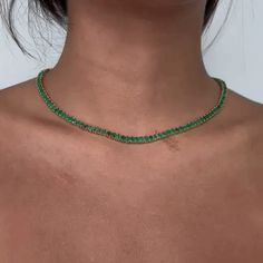 Beautiful Diamond Tennis Necklace. A staple in your jewelry collection. Handmade in New York City of polished 14k white gold. This tennis necklace showcases a delicate 4 prongs in line chain embellished with dozens of shimmering ( NO Lab Made) Emeralds . Quality to us is important and that is why we hand select our diamonds for premium quality. - 19.00 ct. t. w. Emeralds - 19.61 gr 14k Gold Weight Emerald Tennis Necklace, Emerald Green Jewelry Necklaces, Green Jewelry Necklace, Emerald Jewelry Necklace, Emerald Green Jewelry, Emerald Green Necklace, Green Dinnerware, Prom Necklaces, Diamond Tennis Necklace