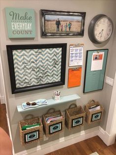 a wall with several baskets and pictures on it