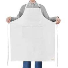 a man in an apron holding up a large white piece of paper that is taped to his chest