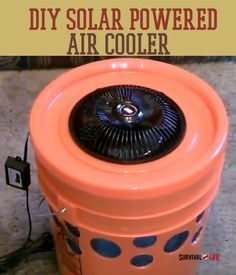 an orange and black container sitting on top of a wooden floor with the words diy solar powered air cooler