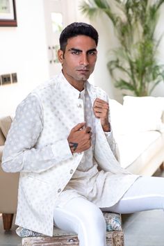 Embroidered bundi jacket in a white and gold art silk base fabric. This jacket is paired with a matching kurta and white pants.
 

Size Chart For Men





	
	
					Men's Size Chart
		

		
		
						
				Size Chart For Men
				Custom Size Measurement Guide
			
			
				
				
				Custom Size Measurement Guide
1. Take your measurements at ease…don’t hold your breath!
2. Be a little generous with the measurements. It’s always easier to take the garment in than to take it out.
3. We do rely on our clie Size Chart For Men, Pants Size Chart, Gold Art, Kurta Set, White Pants, Spring Break, Custom Sizing, Size Chart, Silk