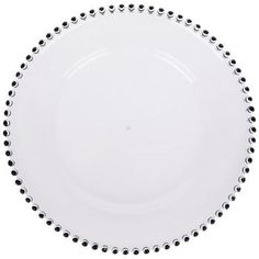 a white plate with black dots on the rim