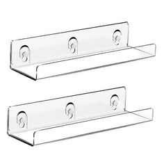 two clear glass shelfs with hooks on each one and the other side is shown