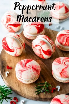 red velvet peppermint macarons on a wooden cutting board