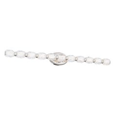 a white beaded bracelet with beads on the end and an oval clasp at the end