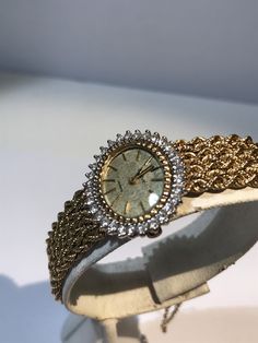 "What a beautiful way to wear the time. This stunning watch is in 14 kt solid gold case and matching mesh style 14kt bracelet band, custom made to fit a 6.5\" wrist with a safety chain as well as a safety clasp. The watch bezel is studded with diamonds that have a total carat weight of over 1 ct. This watch is a quartz style with minimal maintenance as it only needs to have a battery replacement every few years. The watch and matching band are heavy and well made weighing over 34 grams." Timeless Yellow Gold Diamond Watch For Wedding, Gold Round Diamond Watch For Formal Occasions, Yellow Gold Diamond Wedding Jewelry And Watches, Yellow Gold Diamond Jewelry For Wedding, Formal Gold Diamond Jewelry And Watches, Yellow Gold Diamond Wedding Jewelry, Elegant Gold Diamond Watch With Round Face, Timeless Yellow Gold Wedding Jewelry And Watches, Timeless Yellow Gold Jewelry For Wedding