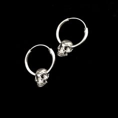 Sterling silver hoop earring has a diameter of 7/8 inch with a .75 inch , hollow , silver plated pewter skull hanging from it. It latches by fitting the wire section back into the hollow hoop. The hoop is 7/8 inch x 2mm thick. The combined pieces measure 1.25 inches. These earrings are SOLD PER PAIR. This piece of jewelry is sent in a bubble pack envelope via US postal service, first class mail,free in the US. International rate is $15. Buyers are responsible for any customs and import taxes tha Metal Hoop Earrings For Streetwear, Silver Jewelry For Streetwear, Internally Threaded Dangle Hoop Earrings As Gift, Edgy Pierced Hoop Earrings As Gift, Punk Stainless Steel Hoop Jewelry, Small Hoop Stainless Steel Jewelry, Punk Style Small Hoop Pierced Jewelry, Gothic Pierced Jewelry For Streetwear, Edgy Silver Jewelry For Everyday