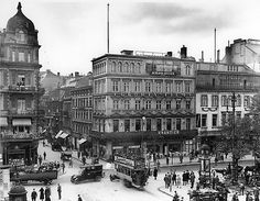 an old black and white photo of a city street