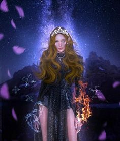 a woman with long red hair wearing a tiara standing in front of a fire