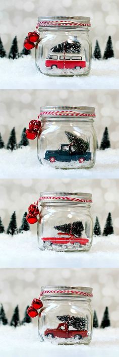 three glass jars filled with red and black christmas decorations on top of snow covered ground