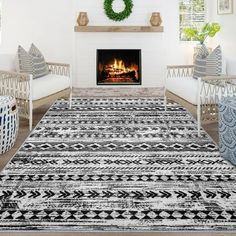 a living room filled with furniture and a fire place in the middle of the room