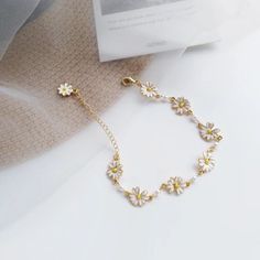 Daisy Enamel Golden Chain Flower Bracelet, Floral White Summer Daisy Charms Gold Bracelet, Small Flowering Daisies Delicate Girl Bracelet - Froppin Flowers Bracelets, Hands Rings, Daisy Charm, Daisy Bracelet, Dresses Design, Bracelets Design, Rings And Bracelets, Rings Necklace, Jewelry Lookbook