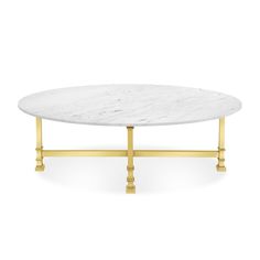 a white marble coffee table with gold legs and an oval shaped design on the top