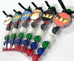 a bunch of lollipops with ninja faces on them