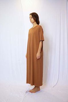 About product    garment dye half sleeve t-shirt maxi dress - this dress features a relaxed t-shirt style with half sleeves a side pocket offering a comfortable and casual look.  crafted from high-quality fabric and garment-dyed to perfection each dress has a unique and slightly lived-in appearance giving it a touch of character and charm.  the soft and breathable material ensures all-day comfort making it ideal for everyday wear.  the maxi length adds a touch of elegance to this laid-back style making it suitable for a variety of occasions.  dress it up with statement accessories and sandals for a bohemian-inspired look or keep it relaxed with sneakers and a denim jacket for a casual day out.  whether you're heading to the beach or meeting up with friends this dress will be your go-to cho Fall Relaxed Fit Short Sleeve T-shirt Dress, Spring Everyday Relaxed Fit T-shirt Dress, Solid Color Short Sleeve Maxi Dress For Daywear, Casual Short Sleeve Midi Dress With Side Slits, Relaxed Fit Midi T-shirt Dress For Spring, Casual Short Sleeve Maxi Dress For Fall, Casual Midi Dress With Side Slits And Short Sleeves, Maxi Dress With Short Sleeves For Daywear, Casual Longline Midi Dress With Relaxed Fit