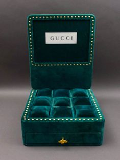 Gucci Vintage Green Velvet Watch Jewelry Store  Display Case Bee Logo
Gucci Vintage Green Velvet Watch Jewelry Store  Display Case Bee Logo With
Removable Backboard

Measures approximately 11 3/4  long, 11 3/4  wide, 18 1/4  high when open, 4
3/4  high.



Pre-owned condition. Item is being sold as found. No chips, cracks or repairs. 

Some age wear such as marks, oxidation to brass and fabric loss to right side
near drawer. Jewelry Store Displays, Bee Logo, Gucci Watch, Watch Jewelry, Gucci Vintage, Logo Sign, Store Display, Shop Ideas, Green Velvet