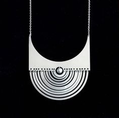 Early Tapio Wirkkala "Puillikuu" Sterling Silver Necklace, 1972 Modern Hallmarked Pendant Necklaces, Modern Hallmarked Pendant Necklace, Modernist Necklace With Polished Finish For Gifts, Handmade Contemporary Metal Necklace, Handmade Contemporary Metal Necklaces, Modernist Metal Pendant Necklace, Modern Engraved Pendant Necklaces, Modern Round Engraved Necklace, Handmade Modern White Gold Necklace