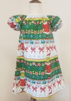 READY TO SHIP! Size 3t  The Grinch Christmas Dress This dress is perfect for Christmas parties, Christmas photos and everyday wear! 100% cotton Elastic in the neckline and sleeves Grinch Dress, Der Grinch, The Grinch Christmas, Halloween Skirt, Christmas Skirt, Jack And Sally, Hawaiian Dress, Christmas Parties, Grinch Christmas