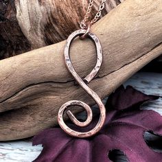 A handmade copper spiral pendant that can be worn anywhere, anytime. Great to wear when you dress up or when you are having a casual type of day. It will always make you look great and well put together. This is a statement piece and truly one of a kind. Make this beauty yours or gift it to someone special in your life. Made with 12-gauge copper wire, this pendant has been shaped into a spiral, hammered for texture, antiqued, polished, and waxed giving it a deep rich look. Each pendant is individually handcrafted by myself, slight variations may occur. If you would like to add a Jewelry Polishing Kit follow this link: https://www.etsy.com/ca/listing/1808007042/jewelry-polishing-kit-brass-copper Earthy Necklace, Copper Chain Necklace, Unisex Christmas Gifts, Spiral Pendant, Jewelry Rustic, Copper Wire Jewelry, Rustic Jewelry, 12 Gauge, Bohemian Necklace