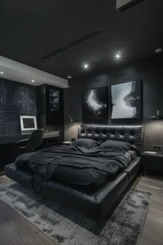 a bedroom with black walls and carpeted flooring has a large bed in the middle