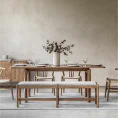 a dining table with four chairs and a bench