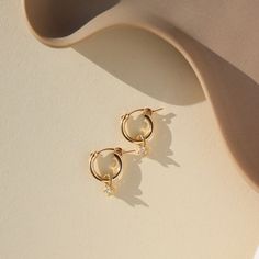 delicate gold fill hoops with dangling cubic zirconium Jewelry Candles, Classic Gold, Earring Sale, Ring Size Guide, Fun Earrings, Gold Hoop, Custom Rings, Free Jewelry, Jewelry Care