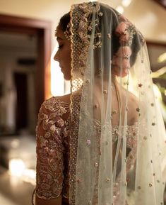 a woman in a bridal gown and veil