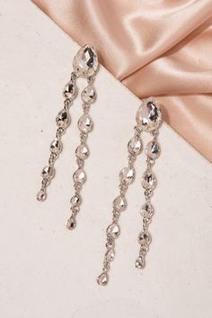 Feel elegant in these teardrop dangle earrings that flow with any outfit and elongate your neck. Cascading teardrop rhinestones that dangle in two tiers from large to small sizes with a post backing great for girls, teens, and women that have their ears pierced! These beautiful statement jewelry will shine like a diamond catching everyone’s eyes! Size• Length: 3.75 in (9.53 cm)• Width: 0.5 in (1.27cm) Quality These well designed post backing earrings use an eco-friendly, lightweight, strong gold Shine Like A Diamond, Ears Pierced, Pearl Shop, Teardrop Dangle Earrings, Pearl Set, Pearl Ring, Statement Jewelry, Fascinator, Stones And Crystals