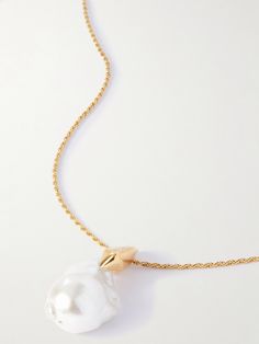 Bottega Veneta's necklace features a sculptural pearl. Crafted in Italy from gold-tone metal, it has an elongated chain that looks especially chic when framed by a v-neckline. Luxury Pearl Chain Necklace, Luxury Pearl Pendant Chain Necklace, Luxury Gold-tone Pearl Chain Necklace, Luxury Long Pearl Charm Necklace, Luxury Long Necklace With Pearl Charm, Luxury Long Necklace With Pearl Pendant, Luxury Long Pearl Pendant Necklace, Luxury Formal Pearl Necklace With Chain, Formal White Pearl Pendant Chain Necklace