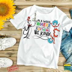 the cat in the hat t - shirt is next to sunflowers and other items