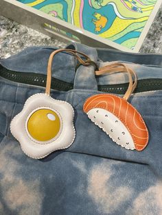 a bag with an egg and sushi on it