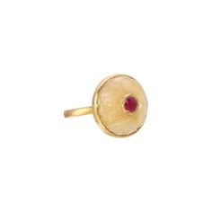 A stylish ring featuring a beautifully carved yellow cabochon Sapphire dome set with a pink Ruby which has been encased in a 'Kundan' style gold setting. - Natural Yellow Sapphire weight approx 15 Carats. - Magenta Pink Ruby weight approx 1.10 Carats, encased in 22 Karat Gold. - Set in an 18 Karat Gold band. - Diameter approx 21mm Depth approx 11mm. Carved Yellow Gold Rings, Yellow Gold Round Enamel Ring With Gemstone, Unique Round Cabochon Ruby Ring, Gold Ruby Ring With Domed Shape, Gold Domed Ruby Ring With Gemstone, Yellow Gold Round Cabochon Enamel Ring, Yellow Gold Enamel Ring With Cabochon, Yellow Gold Enamel Cabochon Ring, Yellow Gold Cabochon Enamel Ring