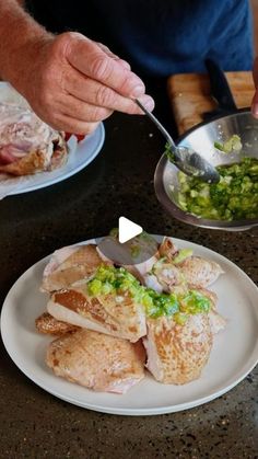 a person is cutting up some food on a plate