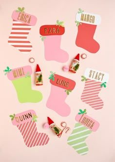 christmas stocking magnets on a pink background