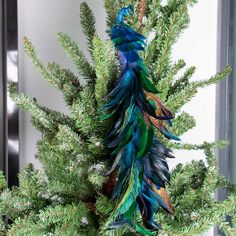 PRICES MAY VARY. Quality Material: Our artificial peacock decoration is made of natural feathers and foam, bright in color and soft to the touch, very like a real peacock. Size: This simulated peacock ornament is 45x7x7cm/17.7x2.8x2.8 inches. There is a metal clip under each artificial peacock bird, which is firmly attached and can be clipped anywhere at will. Realistic Design: This blue peacock decor with long artificial feathers, smart eyes and shiny body. The shape is cute and realistic, very Peacock Christmas Decorations, Peacock Theme Wedding, Christmas Peacock, Tree Colour, Peacock Christmas Tree, Grinch Wreath, Peacock Ornaments, Peacock Christmas, Peacock Theme