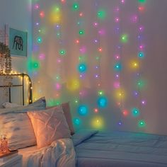 a bedroom with lights hanging from the ceiling