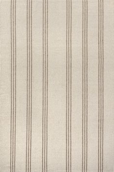 a beige and brown striped rug