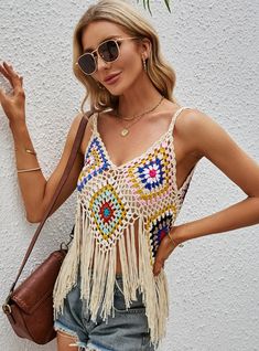 Product category: halter topCollar type: V-neckVersion: slim typeLength: short (40cm＜ < length ≤50cm)Pattern: hollow outColor: white, beigeSize: average size Summer V-neck Beach Crop Top, Bohemian V-neck Crop Top For Beach Season, Summer V-neck Crop Top For Vacation, Trendy V-neck Crop Top For Beach, Bohemian V-neck Halter Top For Summer, Cream Sleeveless Swimwear For Beach, Trendy Hollow Out Tops For Beach, Trendy V-neck Tank Top For Beach, Multicolor V-neck Tank Top For Beach