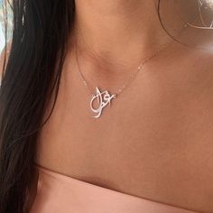 Our jewelry is always long lasting, beautiful, and of the highest quality. Our Persian (Farsi) and Arabic name necklaces are classic, unique pieces that are worth the investment. Personalize your necklace with this beautiful writing. We are happy to translate for you and we can't wait for you to fall in love with your very own piece. Compared to our print calligraphy Persian nameplates, this version has a script calligraphy style font. The letters and names have a more abstract, artistic style. Traditional Rose Gold Necklaces For Anniversary, Traditional Rose Gold Necklace For Anniversary, Elegant Initials Pendant Jewelry, Elegant Silver Initial Pendant Custom Necklace, Elegant Silver Initial Pendant Necklace, Elegant Necklaces With Initials For Anniversary, Elegant Silver Custom Necklace With Initial Pendant, Luxury Custom Name Necklace In Sterling Silver, Luxury Custom Sterling Silver Name Necklace