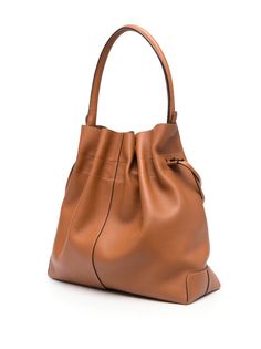 logo-patch leather bucket bag from TOD'S featuring brown, leather, logo patch to the front, internal logo stamp, drawstring fastening, single top handle, main compartment and removable pouch. Size Info UNI Color Detail Leather Brown Made In Italy Material Exterior: 100% calf leather Season One Fall-Winter Season Two Fall-Winter Product bags.. Brand Tod'S Size And Fit Width 13,78 in / 35 cm Height 13,78 in / 35 cm Depth 5,91 in / 15 cm Handle 6,69 in / 17 cm Designer Leather Satchel With Large Capacity, Designer Everyday Bucket Bag, Classic Bucket Hobo Bag For Shopping, Designer Bucket Hobo Bag With Leather Handles, Designer Bucket Hobo Bag With Removable Pouch, Designer Hobo Bucket Bag With Removable Pouch, Designer Everyday Bucket Satchel Bag, Chic Brown Calf Leather Bucket Bag, Designer Bucket Hobo Bag