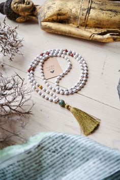 Spiritual jewelry, mala, jewelry, necklaces, 108 beads, mantra mala, chakra healing, tassel necklace, gift for him, calm the mind, hand made mala, yoga mala beads. ----- FREE SHIPPING -------  This listing is for ONE mala necklace. This healing mala necklace features 108 beads (6mm) of Howlite Mookaite + Agate(guru). Whether as a calming meditation guide or a beautiful, neutral, and natural statement piece, this necklace will be a great addition to your spiritual practice. GEMSTONE PROPERTIES: - White Spiritual Beads For Festival, Spiritual Tassel Necklace With 108 Round Beads, White Adjustable Mala With Gemstone Beads, Adjustable White Mala With Gemstone Beads, Adjustable White Gemstone Beads Mala, Bohemian Mala With Colorful Beads For Meditation, White Beaded Necklaces With Natural Stones For Meditation, White 8mm Beads For Festival, White Bohemian Necklaces For Rituals